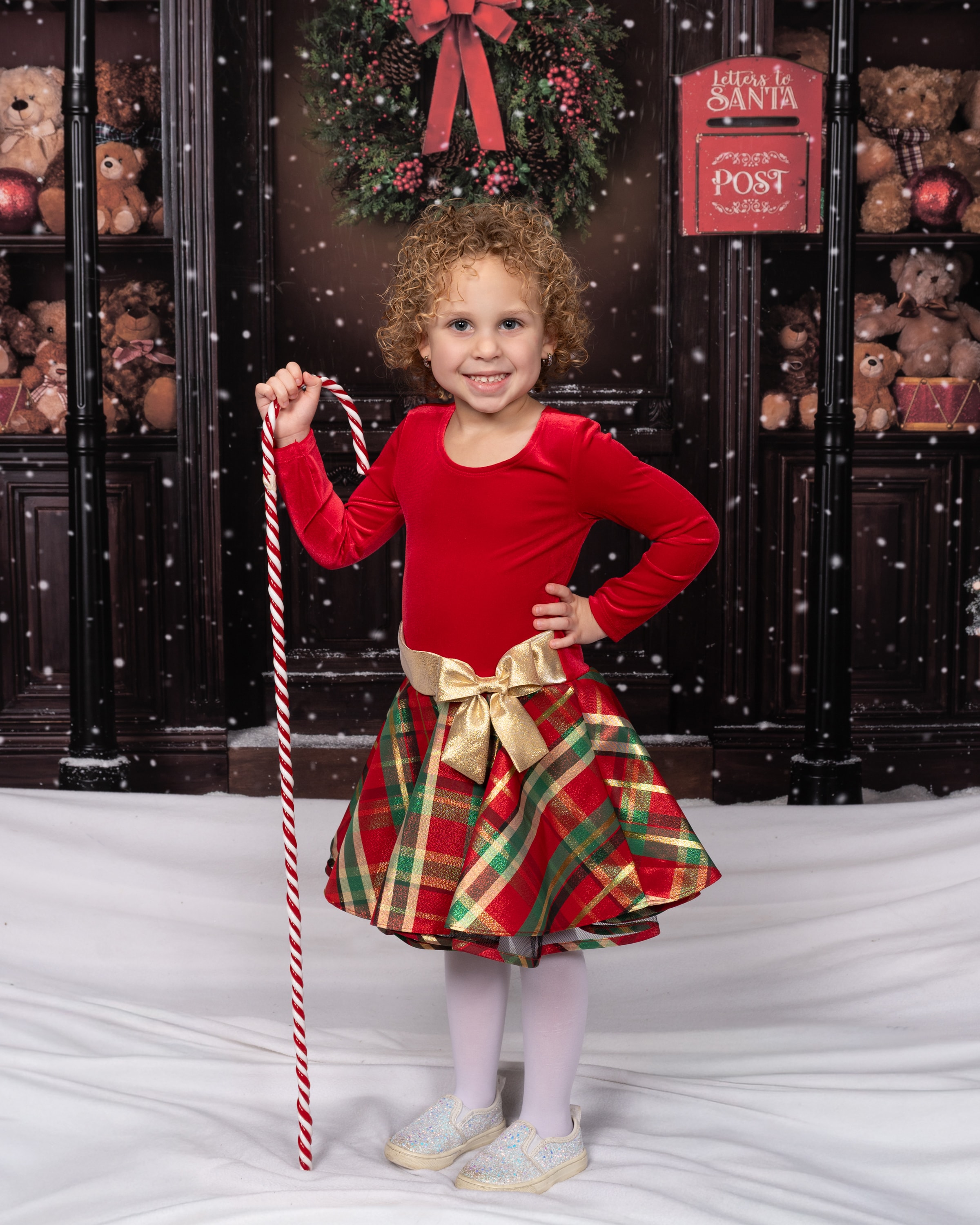 Child with candy cane Santa's workshop backdrop